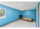 Light blue bedroom with large window and a minimalist bed frame at 2935 Willow Bay Ter, Casselberry, FL 32707