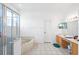 Main bathroom featuring a glass shower enclosure, soaking tub, and vanity at 2935 Willow Bay Ter, Casselberry, FL 32707