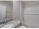 Bathroom featuring granite countertops and shower with white subway tile at 315 Marquee Dr, Kissimmee, FL 34758