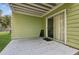 Back patio area with a sliding glass door and space for outdoor seating at 3151 Britannia Blvd # A, Kissimmee, FL 34747