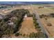 Aerial view of the expansive property, showcasing land and nearby community at 37224 Apiary Rd, Grand Island, FL 32735