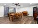 Bright dining area with natural light, comfortable seating, and wood-look tile floors at 37224 Apiary Rd, Grand Island, FL 32735