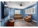 Bright living room with recessed lighting, comfortable leather seating, and plantation shutters that add to its appeal at 37224 Apiary Rd, Grand Island, FL 32735