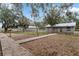 Wide shot of grounds showing the main residence, horse paddocks and barns at 37224 Apiary Rd, Grand Island, FL 32735