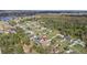 Aerial view of a neighborhood with a lake and a home with a private pool at 4100 Cannon Ct, Kissimmee, FL 34746