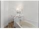 Bathroom featuring a soaking tub, a separate shower, and wood flooring at 4135 Iveyglen Ave, Orlando, FL 32826