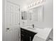 Modern bathroom featuring updated vanity, mirror, and contemporary lighting at 4135 Iveyglen Ave, Orlando, FL 32826