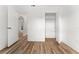 Bedroom featuring wood-look flooring and doors leading to the closet and hallway at 4135 Iveyglen Ave, Orlando, FL 32826