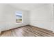 Well-lit bedroom featuring laminate floors, a large window, and ample natural light at 4135 Iveyglen Ave, Orlando, FL 32826