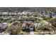 Aerial view of homes in a residential community with a lake in the background at 418 Laurenburg Ln, Ocoee, FL 34761