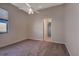 Cozy bedroom featuring neutral tones, carpet flooring, and a door to the bathroom at 418 Laurenburg Ln, Ocoee, FL 34761