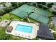 Aerial view of community tennis and basketball courts with a pool at 418 Laurenburg Ln, Ocoee, FL 34761