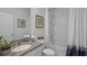 Well-lit bathroom featuring a granite countertop, a single sink, and a tub/shower combination at 4253 Singing Mockingbird Blvd, Bartow, FL 33830