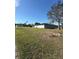 Spacious backyard with green grass, with a view of the house at 4405 Sw 155Th Place Rd, Ocala, FL 34473