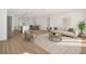 Bright, open-concept living room flows into dining area, featuring modern furnishings and hardwood floors at 4405 Sw 155Th Place Rd, Ocala, FL 34473