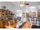 Bright dining room with dark wood floors, adjacent to kitchen and living room at 53 High Vista Dr, Davenport, FL 33837