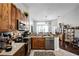 Well-equipped kitchen with stainless steel appliances and granite countertops at 53 High Vista Dr, Davenport, FL 33837