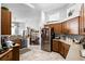 Spacious kitchen with stainless steel appliances and tiled flooring at 53 High Vista Dr, Davenport, FL 33837