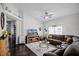 Comfortable living room featuring a plush sectional sofa, a large window, and elegant decor at 53 High Vista Dr, Davenport, FL 33837