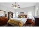 Comfortable main bedroom with two windows and ceiling fan at 53 High Vista Dr, Davenport, FL 33837