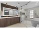 Modern bathroom features sleek vanity, and frameless glass shower, and separate soaking tub at 5447 Brookline Dr, Orlando, FL 32819