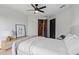 Well-lit bedroom with closet, ceiling fan, comfortable bed, and modern décor at 5447 Brookline Dr, Orlando, FL 32819