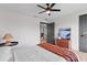 Bright bedroom featuring wood floors, modern furniture, and a black ceiling fan at 5447 Brookline Dr, Orlando, FL 32819