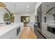 Bright, modern kitchen with marble countertops, an island, and stainless steel appliances at 5447 Brookline Dr, Orlando, FL 32819