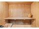 Traditional wooden sauna with bench seating and a wooden bucket at 5447 Brookline Dr, Orlando, FL 32819