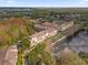 Aerial view of multi-story condos near lake and mature trees at 706 Westpark Way # 203, Celebration, FL 34747