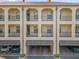 Multi-story condo building with covered parking and balconies at 706 Westpark Way # 203, Celebration, FL 34747