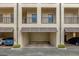 Covered garage parking with brick pavers and convenient access at 706 Westpark Way # 203, Celebration, FL 34747