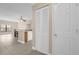 Open-concept hallway with white closet doors and views into living area at 706 Westpark Way # 203, Celebration, FL 34747