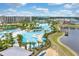 Resort aerial view featuring the hotel, pool, recreational facilities, and a waterfront view at 8179 Coconut Pl, Kissimmee, FL 34747