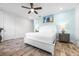 Spacious bedroom featuring beach-themed art and side tables with lamps, creating a cozy retreat at 8179 Coconut Pl, Kissimmee, FL 34747