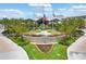 The Margaritaville Resort entrance framed by lush greenery and three flags waving in the sky at 8179 Coconut Pl, Kissimmee, FL 34747