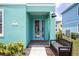 Close up of the entrance of a home with a bench and address marker at 8179 Coconut Pl, Kissimmee, FL 34747