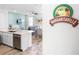 Bright kitchen with stainless steel appliances, an island with white countertops, and a Margaritaville sign at 8179 Coconut Pl, Kissimmee, FL 34747