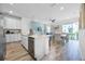 Bright modern kitchen and dining area with tile floors at 8179 Coconut Pl, Kissimmee, FL 34747