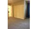 Neutral bedroom with carpet and large window with access to hall at 944 Bakewell Ct # 106, Lake Mary, FL 32746