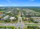 An aerial view showcasing the neighborhood's proximity to a large highway, retail buildings, and community at 114 Vista Verdi Cir # 328, Lake Mary, FL 32746
