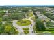 This aerial view features a landscaped roundabout with a water fountain in a planned community at 114 Vista Verdi Cir # 328, Lake Mary, FL 32746