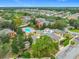 An aerial view showcasing the community pool, clubhouse, landscaping, and surrounding residential buildings at 114 Vista Verdi Cir # 328, Lake Mary, FL 32746