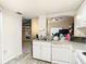Cozy kitchen featuring white cabinetry, modern appliances, and an open layout perfect for entertaining at 114 Vista Verdi Cir # 328, Lake Mary, FL 32746
