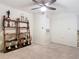 Bright loft with a ceiling fan, soft carpet, and a collection of trophies displayed on decorative shelving at 114 Vista Verdi Cir # 328, Lake Mary, FL 32746