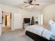 Tranquil main bedroom featuring soft carpet, ceiling fan, and ample closet space at 114 Vista Verdi Cir # 328, Lake Mary, FL 32746