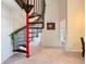 Unique spiral staircase with red and black accents and carpeted steps in a naturally lit entry way at 114 Vista Verdi Cir # 328, Lake Mary, FL 32746