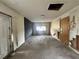 Unfinished basement with block wall, unfinished ceiling, and natural light from the open window at 115 S Lake Pleasant Rd, Apopka, FL 32703
