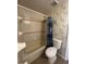 Bathroom featuring shower and floral wallpaper at 121 Loma Bonita Dr, Davenport, FL 33837