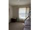 Bedroom with bunkbeds with tan carpet and natural light from the window at 121 Loma Bonita Dr, Davenport, FL 33837